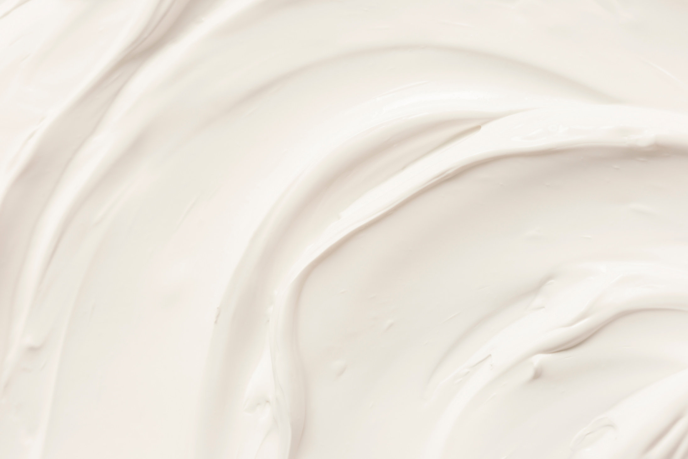 Cosmetics. Cream white background texture.